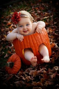 Cute Baby Enjoying Halloween in a Sliding Pumokin